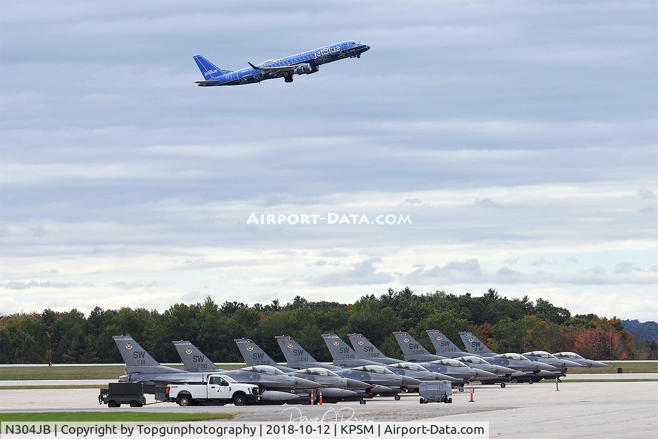 N304JB, 2009 Embraer ERJ-190-100 IGW 190AR C/N 19000257, Jet Blue departing RW34 with Shaw F-16s on the ramp