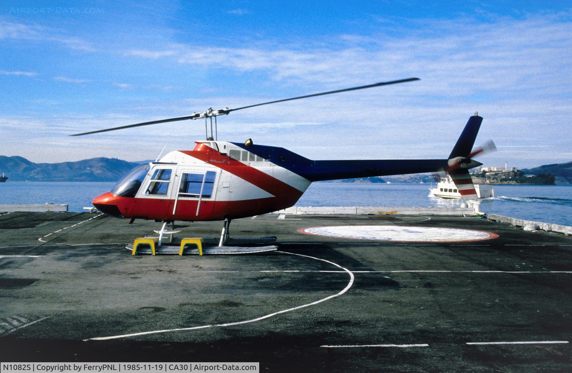 N1082S, Bell 206B C/N 2902, Commodore Helicopters B206 at Commodore Helipad SFO. In the background Alcatraz Island.