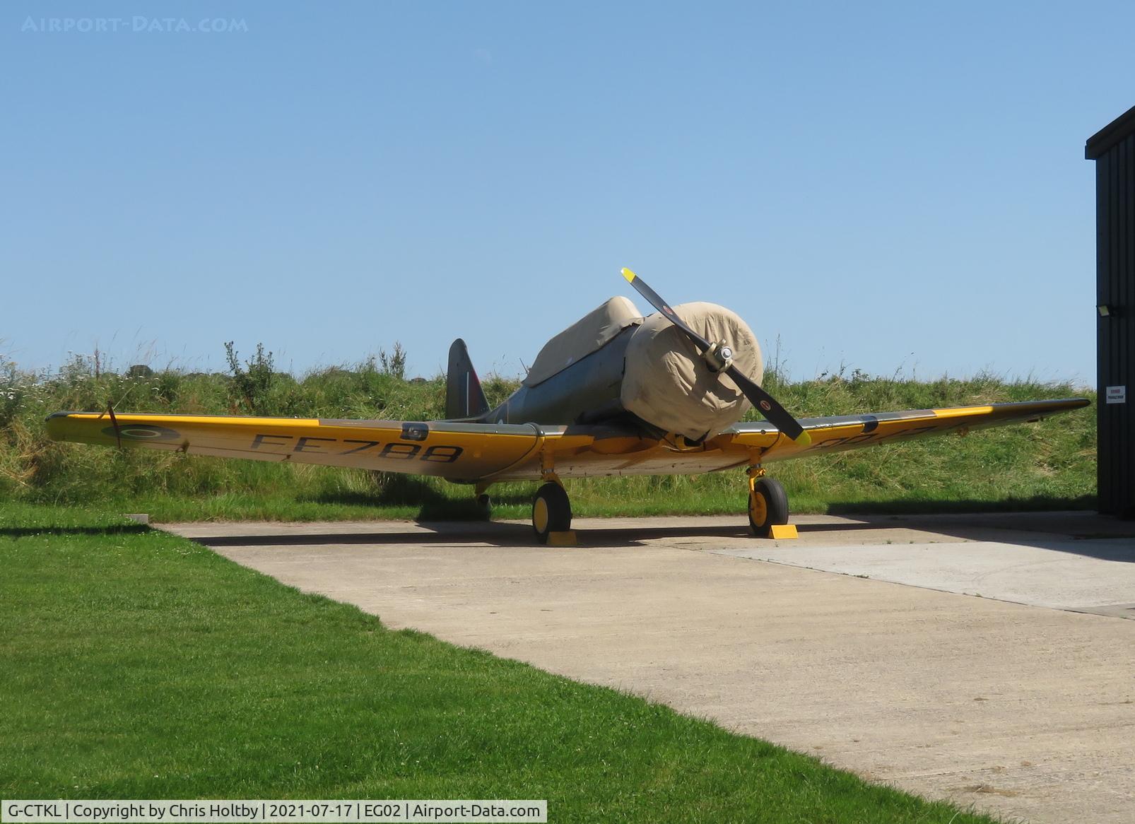 G-CTKL, 1941 Noorduyn AT-16 Harvard IIB C/N 07-30, Parked under its cover at Audley End, Essex
