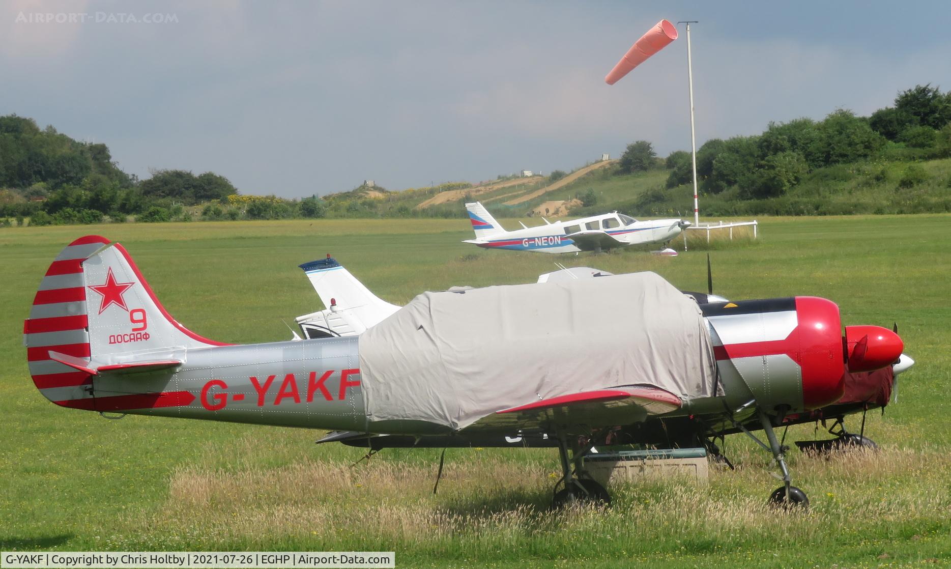 G-YAKF, 1991 Yakovlev (Aerostar) Yak-52 C/N 9111205, Parked & covered at Popham