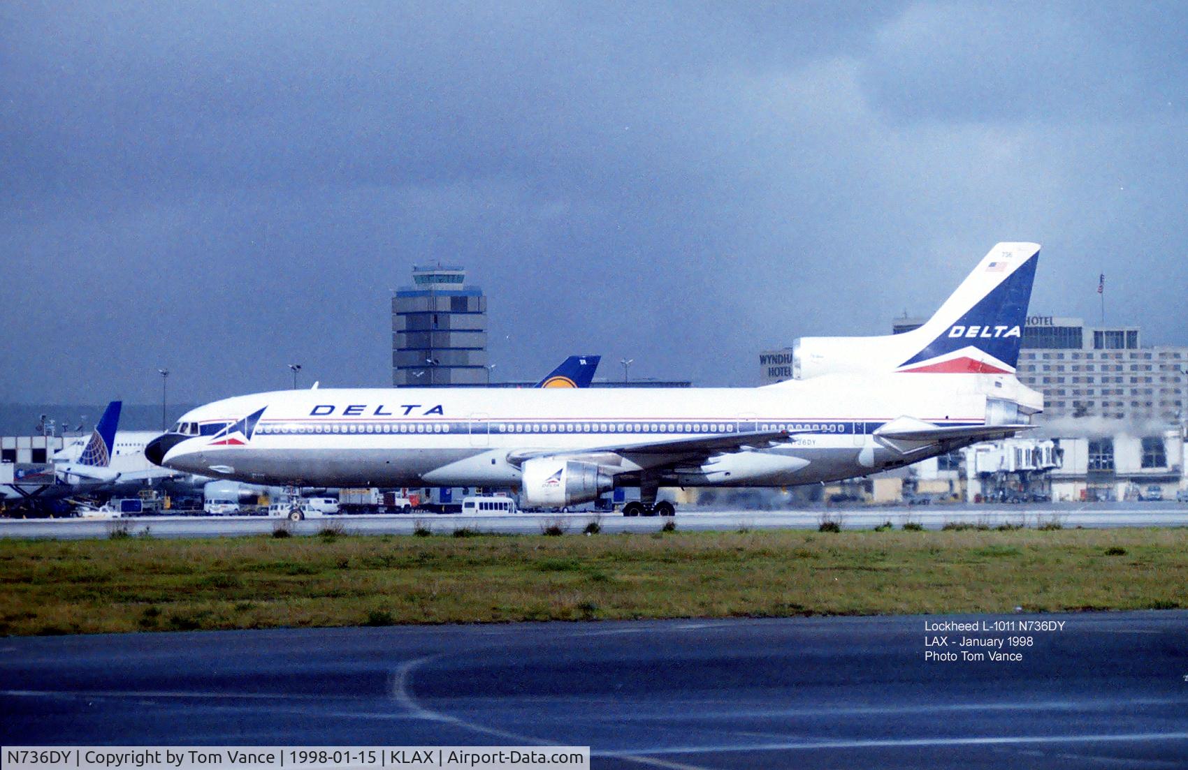 N736DY, Lockheed L-1011-385-1-15 TriStar 250 C/N 193C-1227, from the Imperial Terminal at LAX January 1998 - an Intl L-1011 from Delta rolling out on 25L for the cross-over.