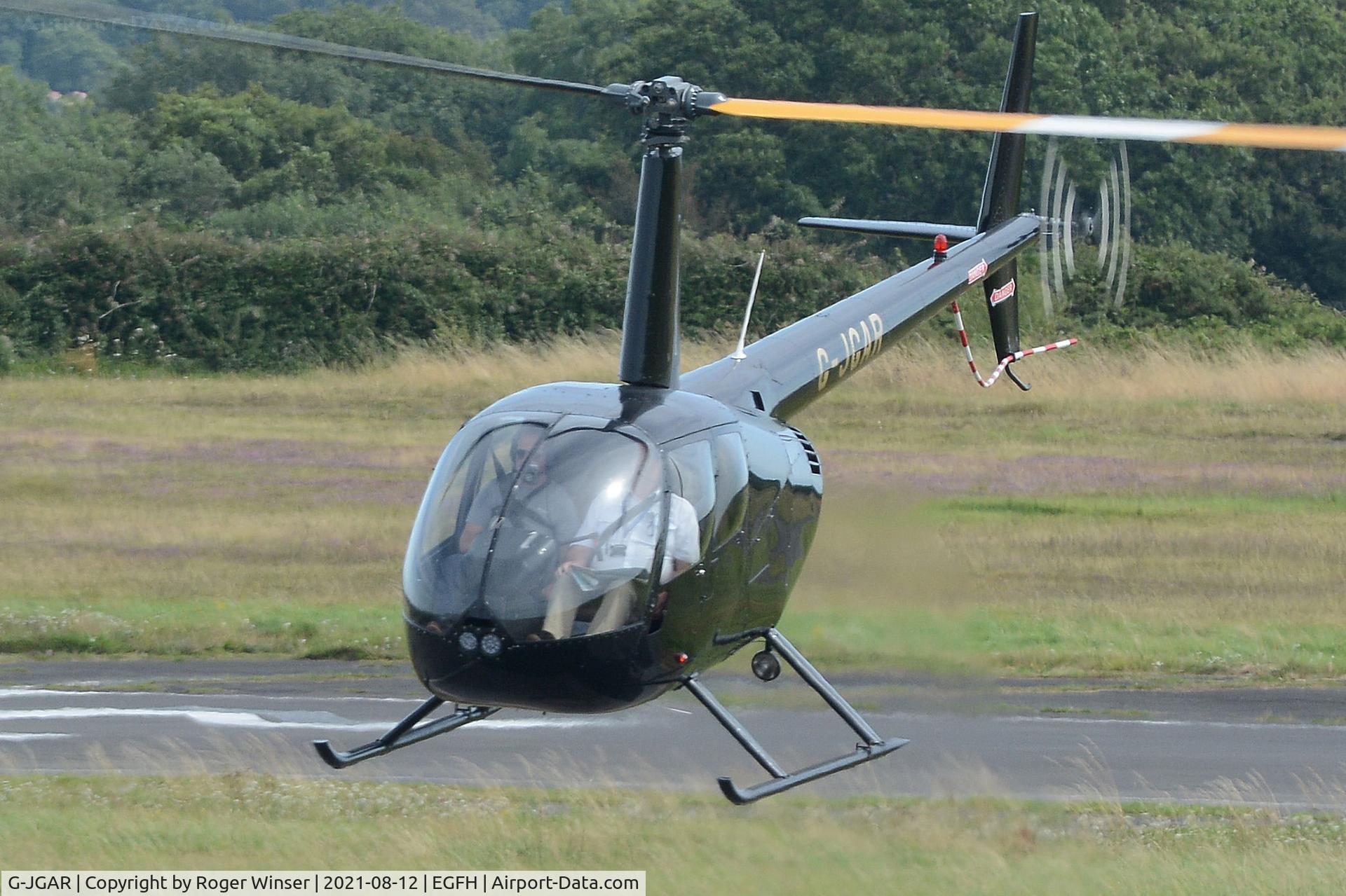 G-JGAR, 2004 Robinson R44 Raven II C/N 10513, Visiting Raven II helicopter arriving.