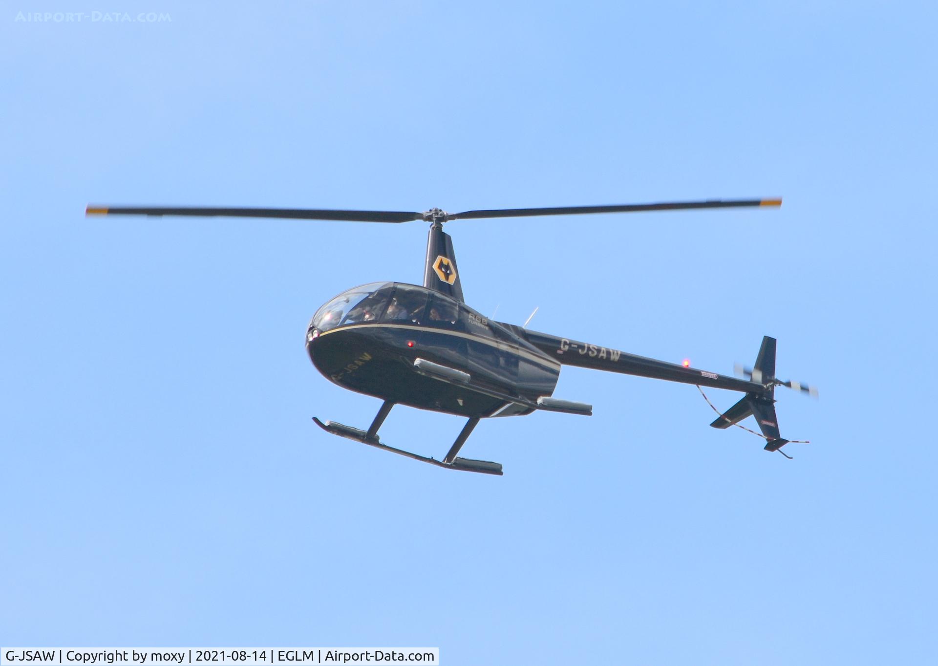 G-JSAW, 2011 Robinson R66 Turbine C/N 0058, Robinson R66 Turbine landing at White Waltham.