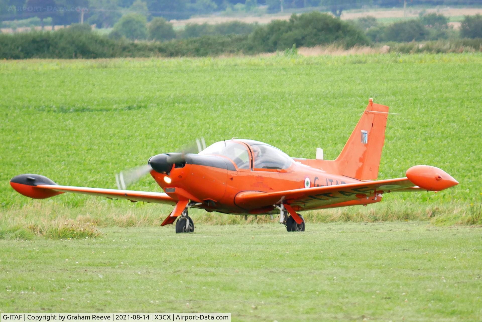 G-ITAF, 1983 SIAI-Marchetti SF-260AM C/N 40-013/690, Just landed at Northrepps.