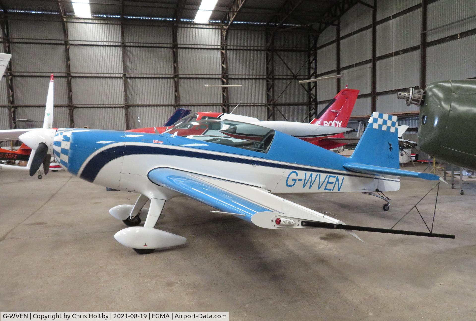 G-WVEN, 2014 Extra EA-300/200 C/N 1046, 2014 Extra safely stored in the hangar at Fowlmere, Cambs.