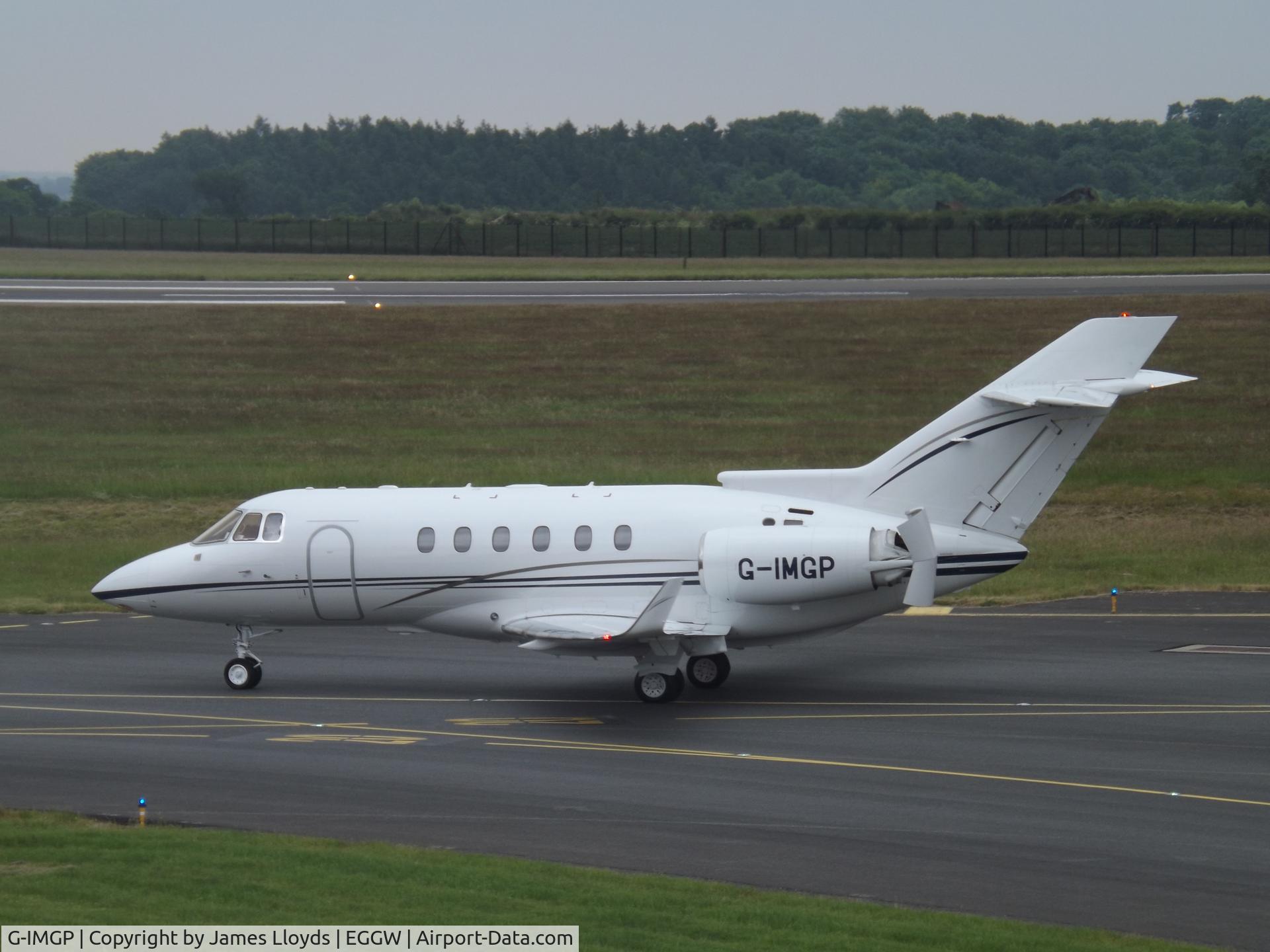 G-IMGP, 2006 Raytheon Hawker 850XP C/N 258778, Taxing in to Luton Airport.