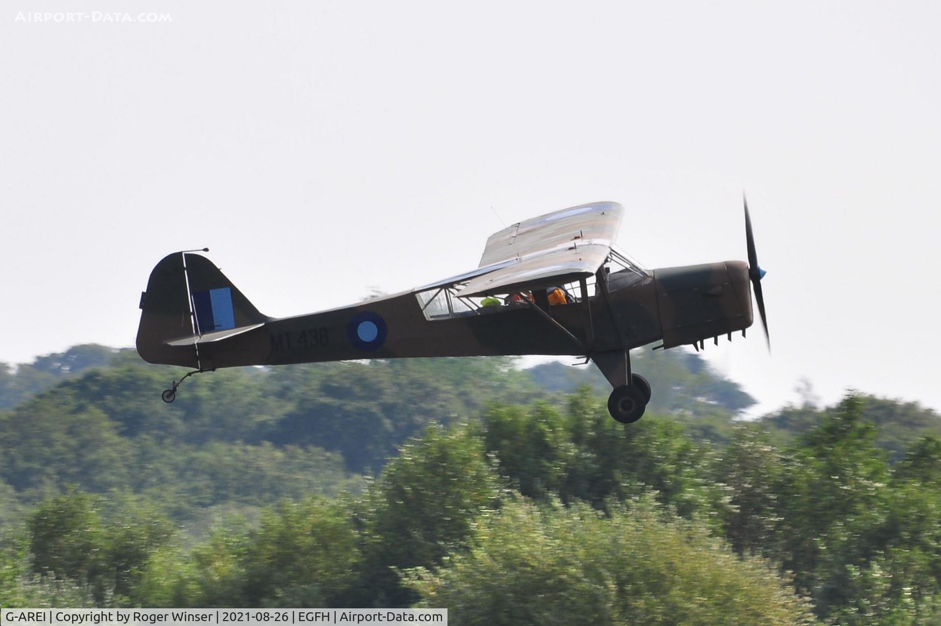G-AREI, 1943 Taylorcraft E Auster 3 C/N 518, Visiting ex-AAC Auster AOP.3 aircraft MT438 in WW2 SEAC camouflage and markings departing Runway 28.