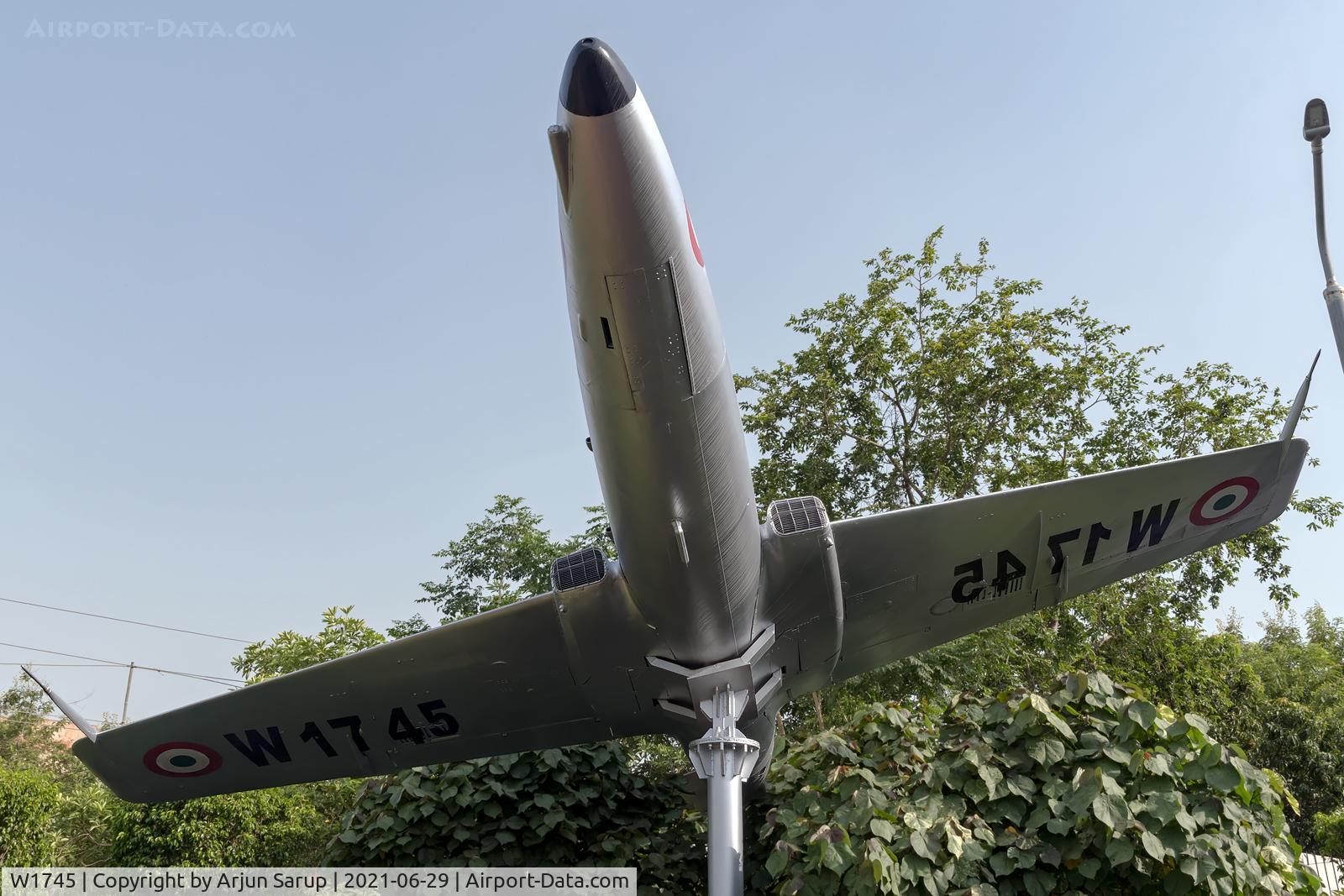 W1745, PZL-Mielec TS-11 Iskra C/N 3H-1420, Hemmed in by lampposts, trees and hedges at Shaheed Smarak Park, Noida, this Iskra should be effectively camouflaged in a few years.  The Iskra was inducted in the IAF in Oct. 1975 and served as a stage two trainer for many years.
