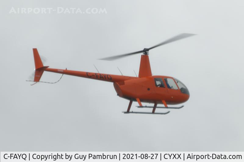 C-FAYQ, 2008 Robinson R44 II C/N 12808, Landing at YXX.  Forest fire smoke blanketed the area