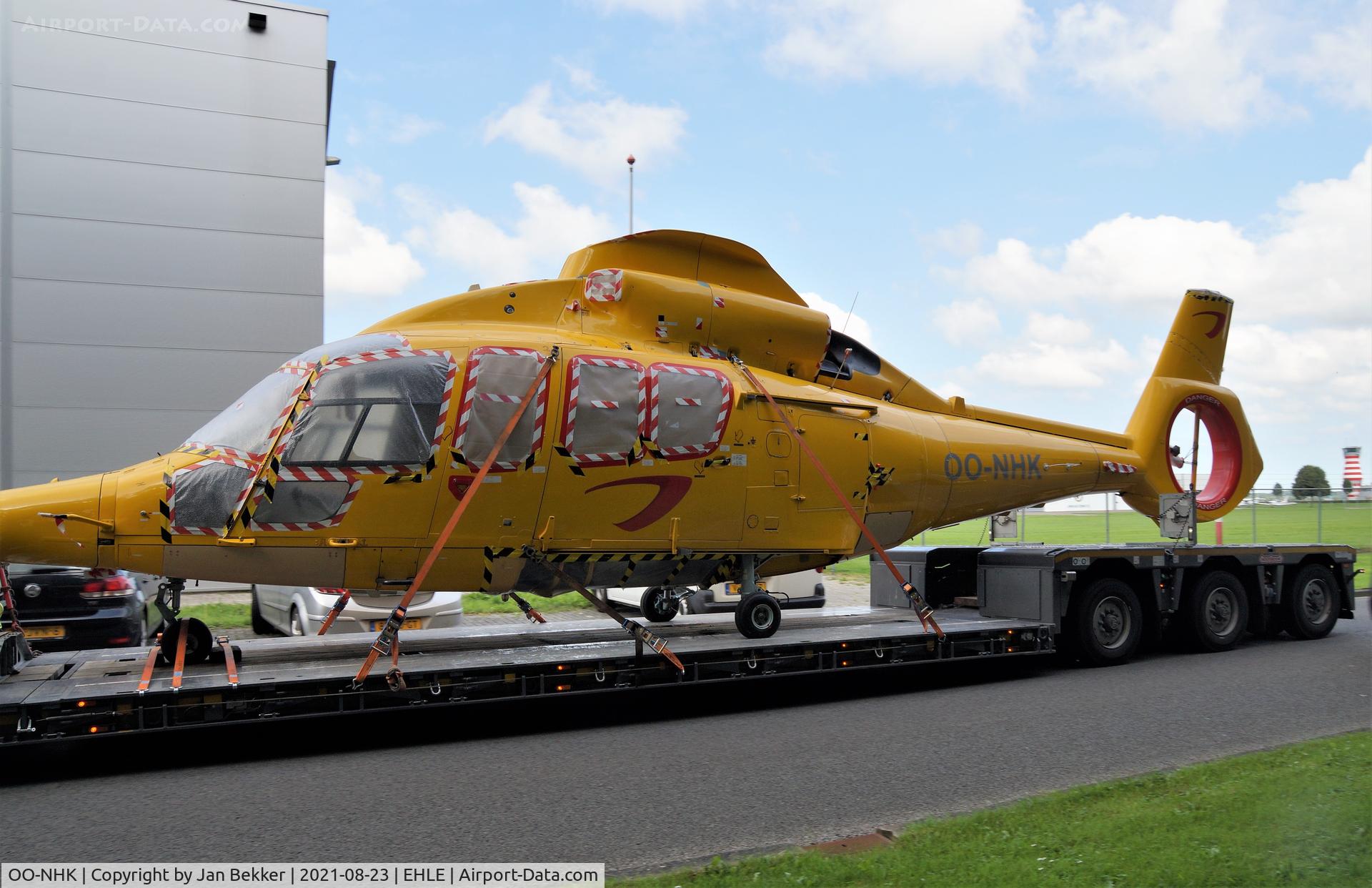 OO-NHK, 2009 Eurocopter EC-155B-1 C/N 6876, Arriving on a truck at Lelystad Airport. (Roadrunnerlaan) Satys will give the aircraft the  colourscheme of Air Greenland  (Red with white accents)