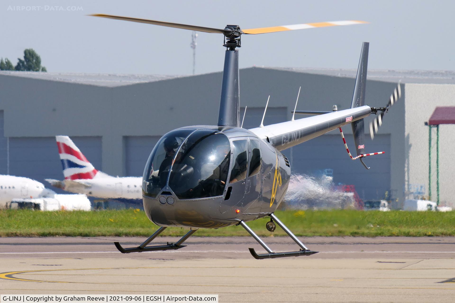 G-LINJ, 2008 Robinson R44 Raven II C/N 12168, Departing from Norwich.