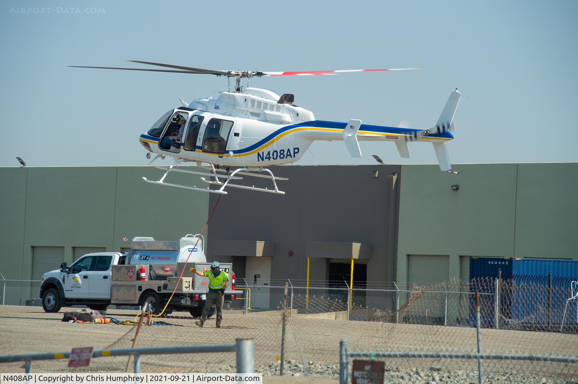 N408AP, 1997 Bell 407 C/N 53197, Working on PG&E towers in San Leandro California.