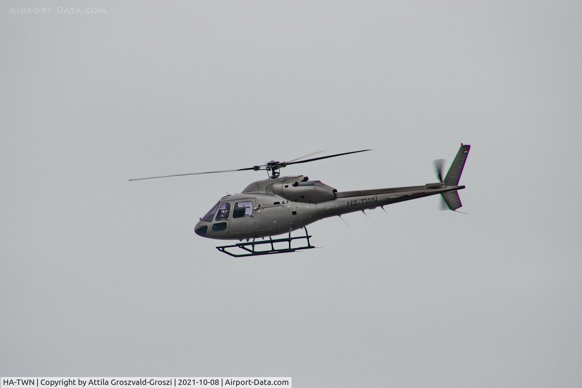HA-TWN, 1997 Aerospatiale AS-355F-2 Ecureuil 2 C/N 5614, Working from an external location. He gets up to check electric wires, near Litér settlement.