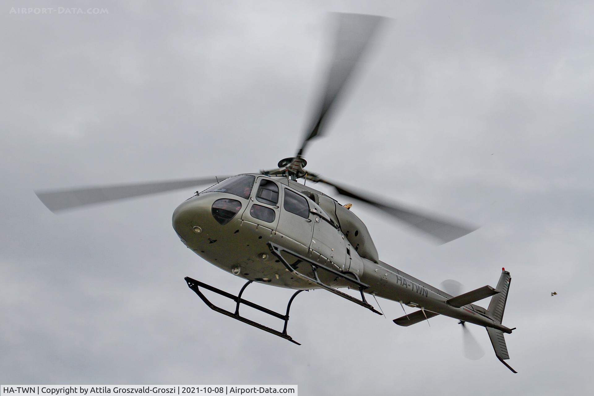 HA-TWN, 1997 Aerospatiale AS-355F-2 Ecureuil 2 C/N 5614, Working from an external location. He gets up to check electric wires, near Litér settlement.