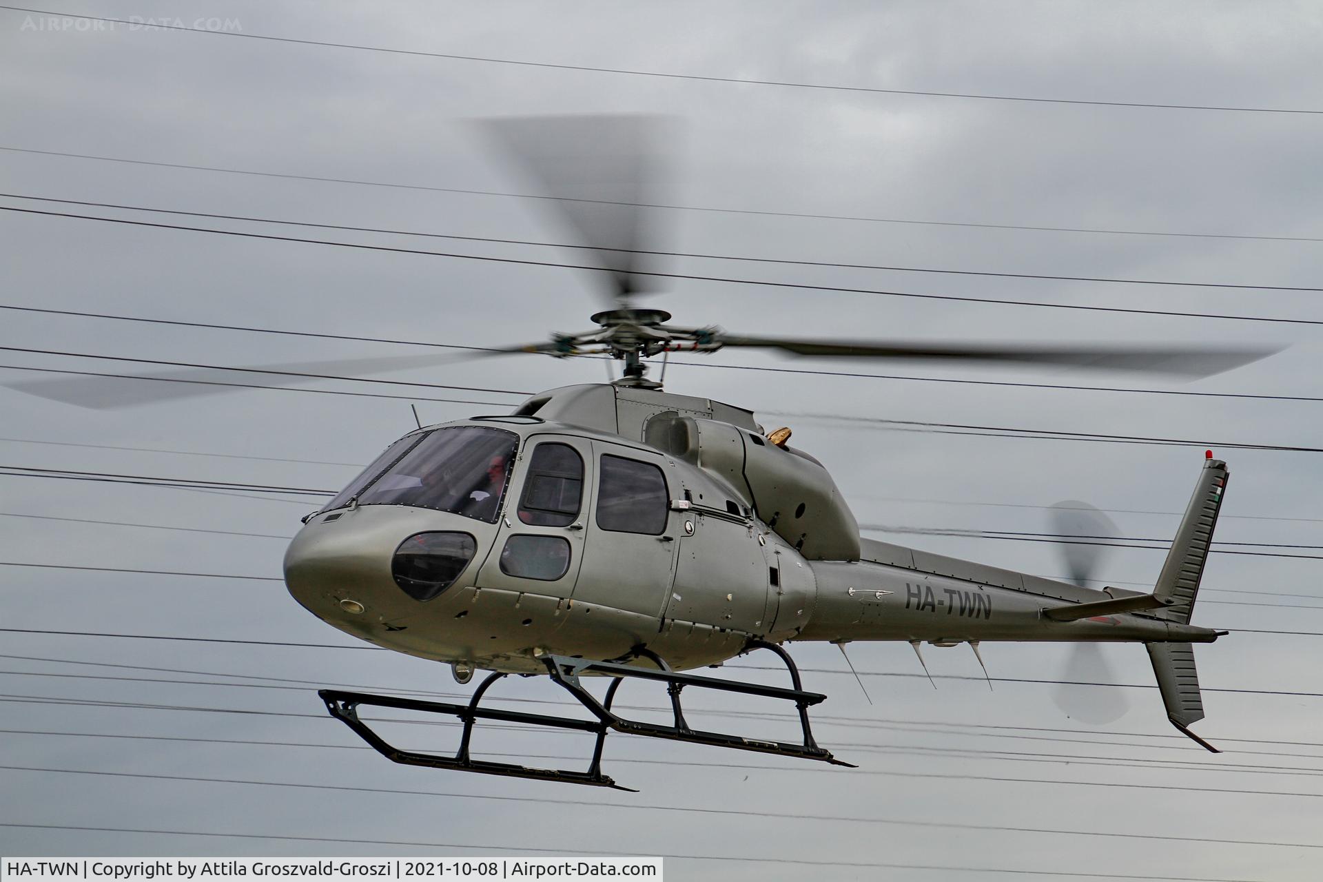 HA-TWN, 1997 Aerospatiale AS-355F-2 Ecureuil 2 C/N 5614, Working from an external location. He gets up to check electric wires, near Litér settlement.