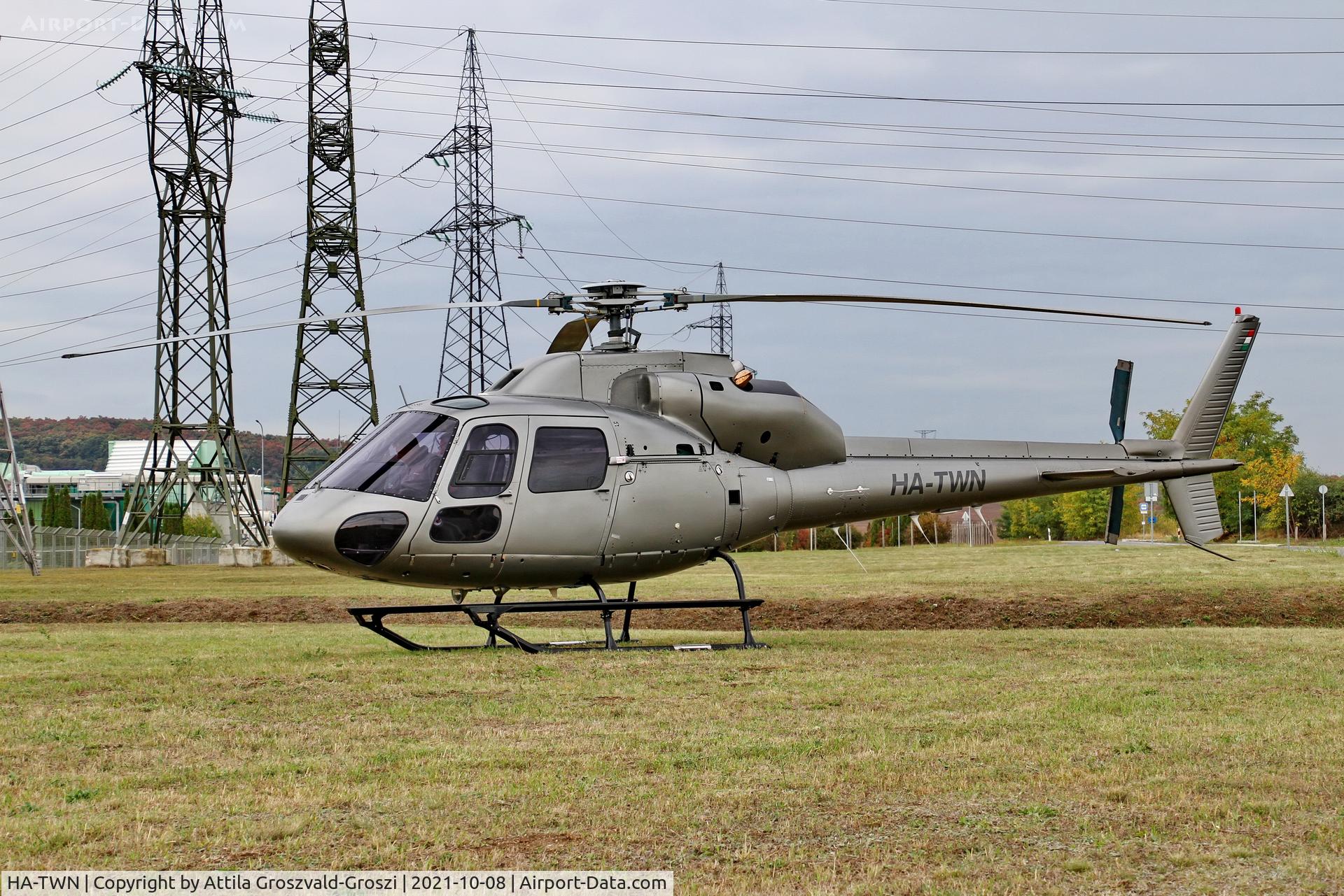 HA-TWN, 1997 Aerospatiale AS-355F-2 Ecureuil 2 C/N 5614, Working from an external location. He gets up to check electric wires, near Litér settlement.