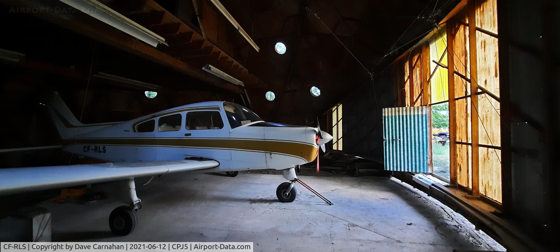 CF-RLS, 1964 Beech A23 C/N M-624, CF-RLS parked in its hangar at CPJ5 (Stirling airport)