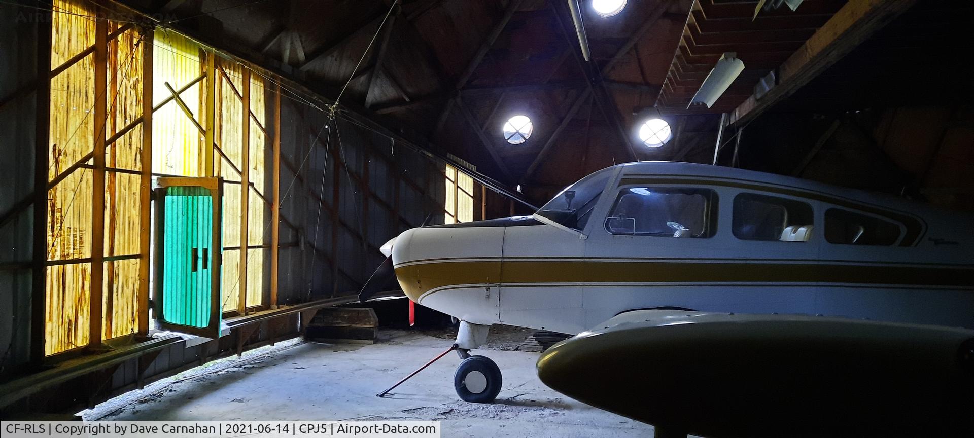 CF-RLS, 1964 Beech A23 C/N M-624, CF-RLS parked in its hangar at CPJ5 (Stirling airport)