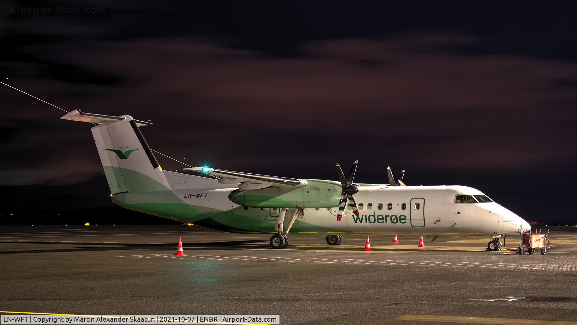 LN-WFT, 1999 De Havilland Canada DHC-8-311 Dash 8 C/N 532, Parked at the ramp. EC-JKH (Swiftair, Embraer 120 Brasília) departing rwy. 17 in the background.