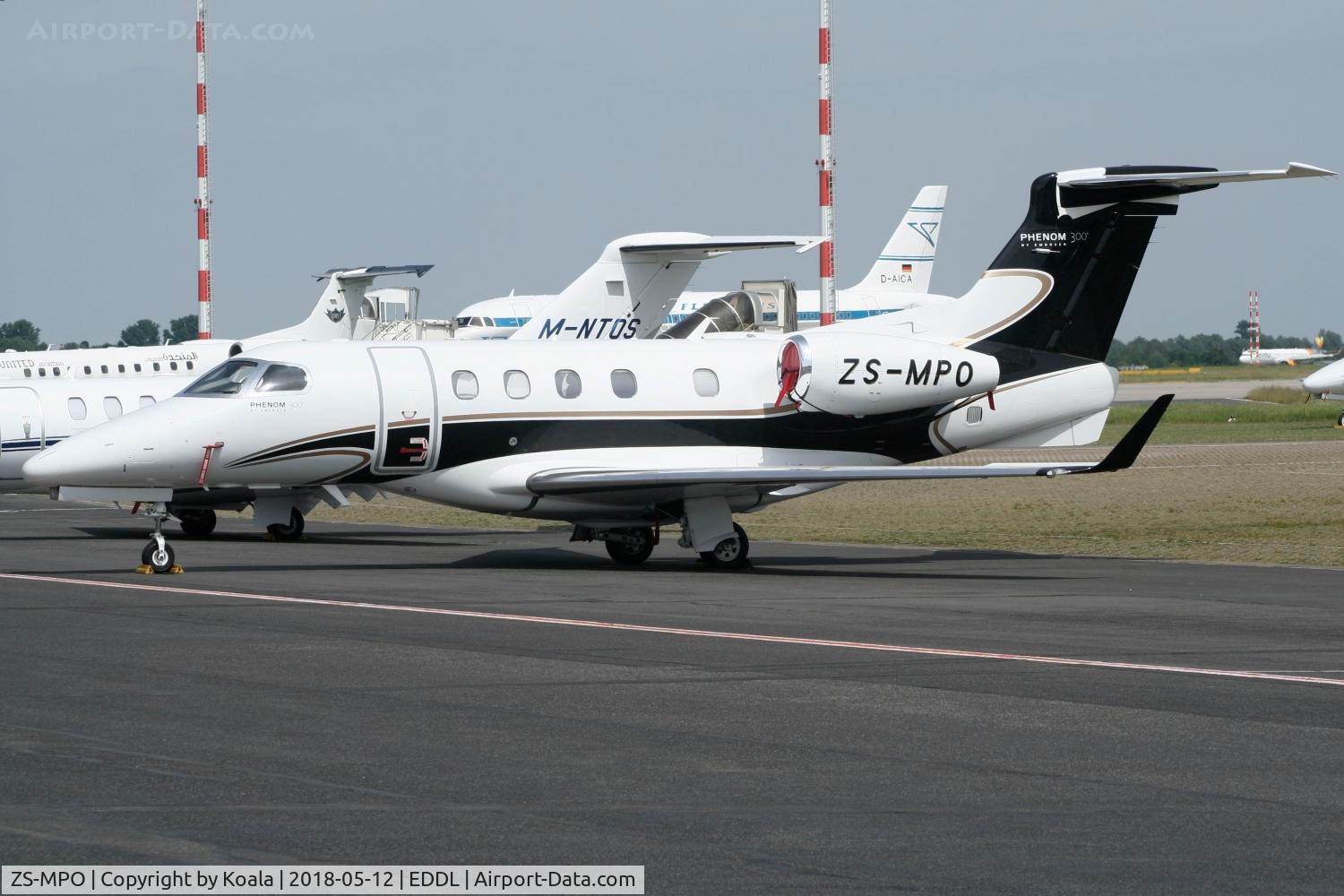 ZS-MPO, 2012 Embraer EMB-505 Phenom 300 C/N 50500127, Resting at GAT