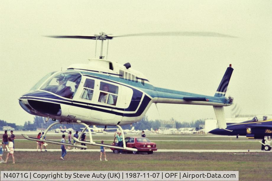N4071G, Bell 206A JetRanger C/N 234, I was on holiday in Florida from the UK and visited the Miami Air Show at Opa-Locka Airport on Saturday 7th November 1987. N4071G is pictured making one of many short pleasure flights throughout the day.
