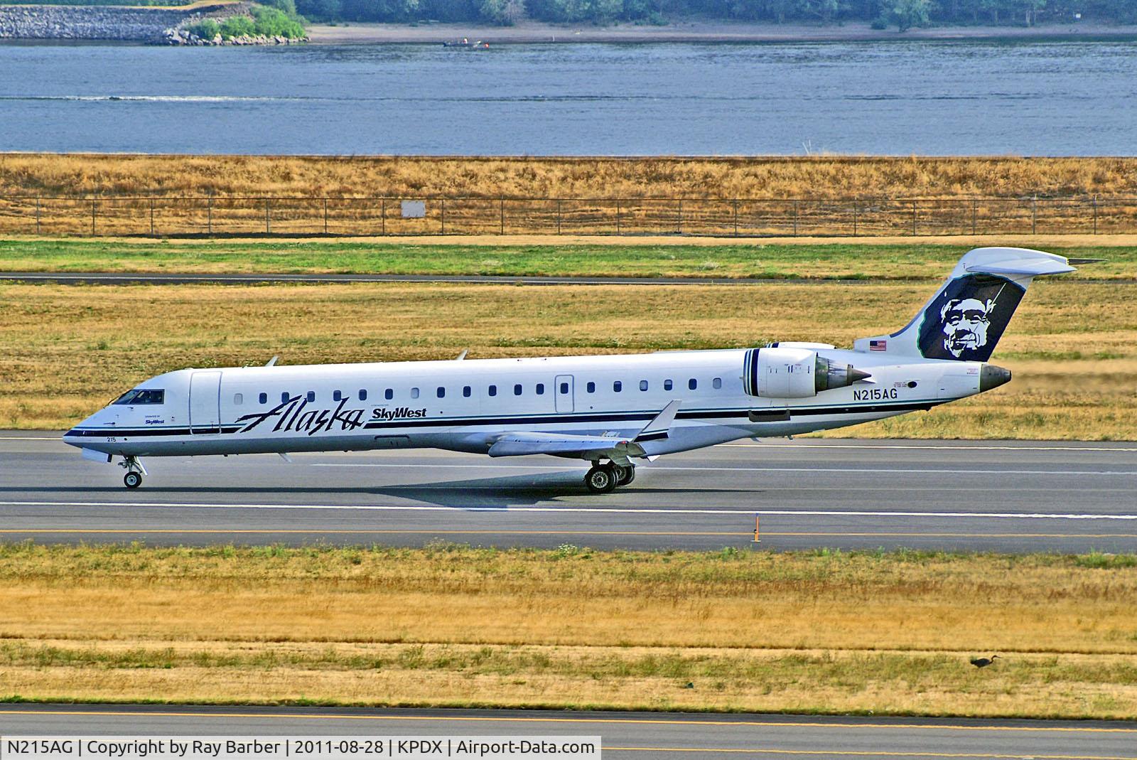 N215AG, 2000 Bombardier CRJ-701 (CL-600-2C10) Regional Jet C/N 10009, N215AG   Bombardier CRJ-701 [10009] (Alaska Airlines / SkyWest) Portland-Int~N 28/08/2011
