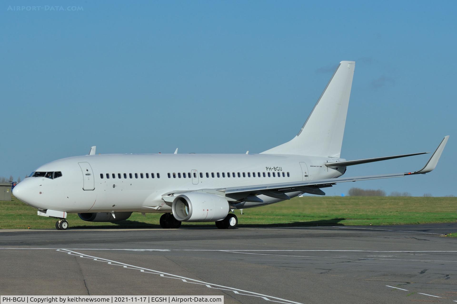 PH-BGU, 2011 Boeing 737-7K2 C/N 39257, Leaving Norwich with all over white colour scheme.