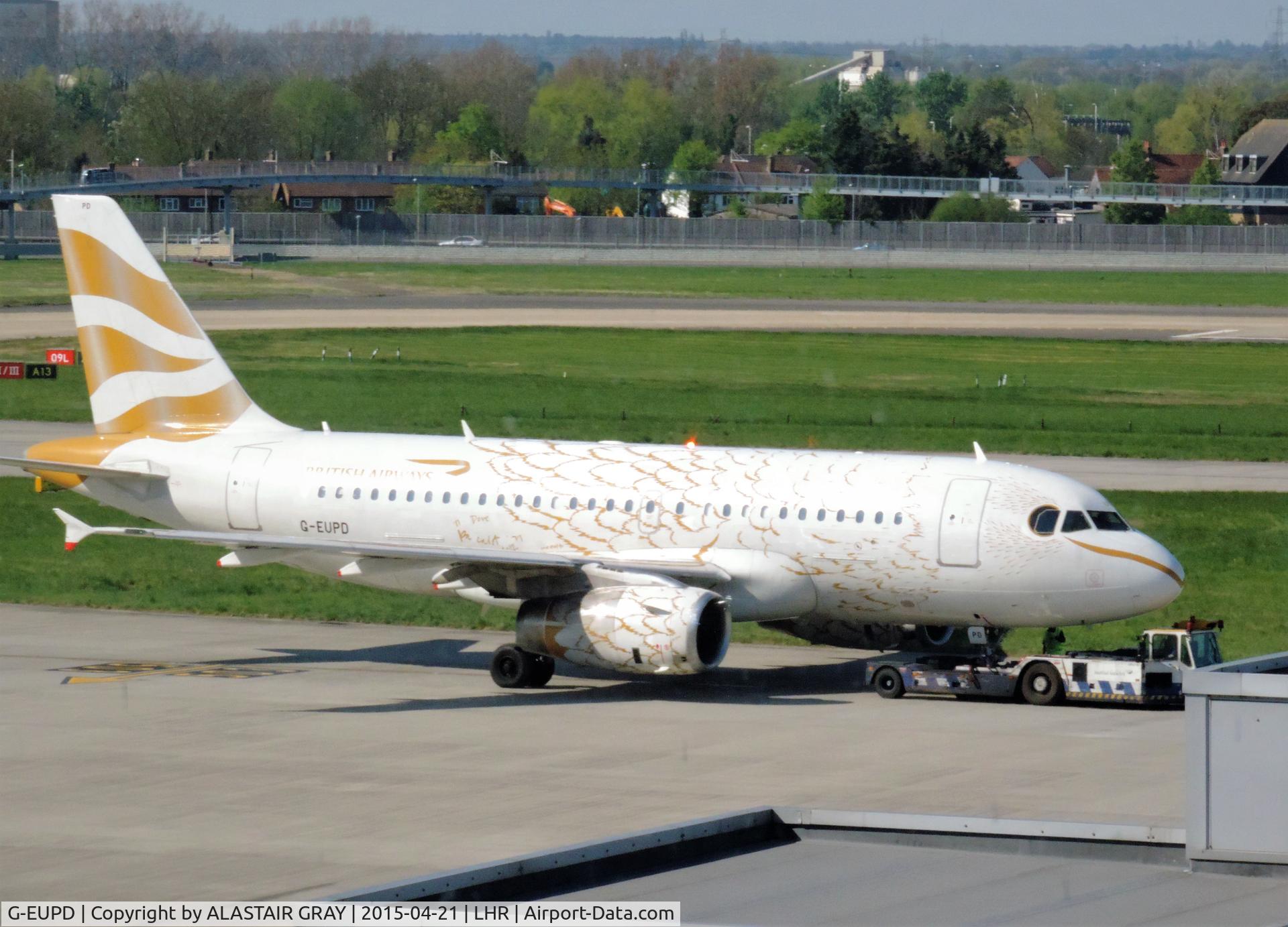 G-EUPD, 1999 Airbus A319-131 C/N 1142, Sporting the 'Eagle colours' livery here during pushback at Heathrow