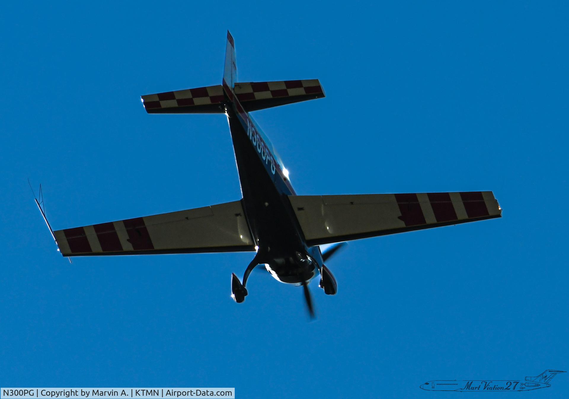 N300PG, 1999 Extra EA-300/L C/N 104, Landing at Tamiami Airport