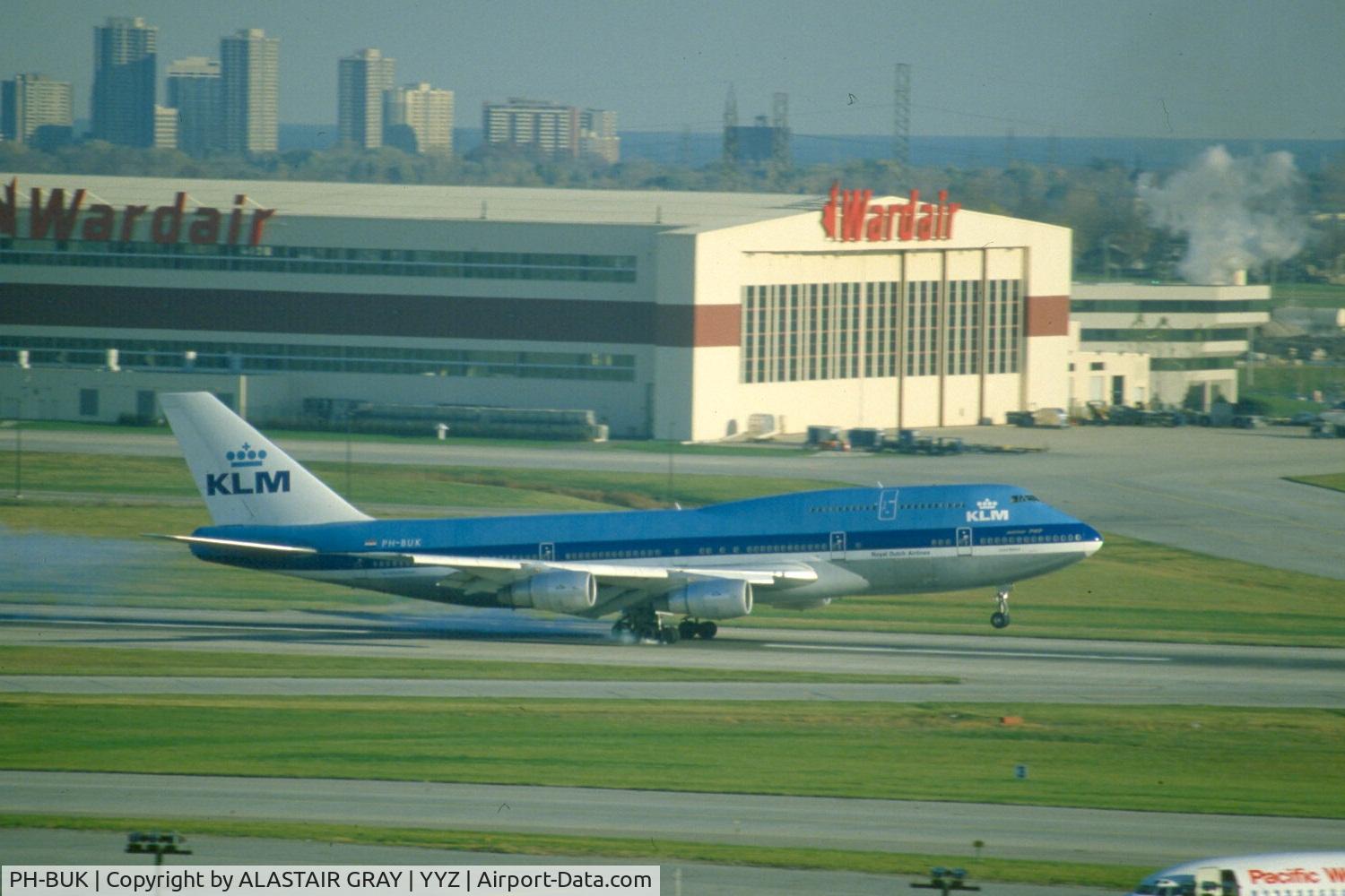 PH-BUK, 1978 Boeing 747-206B (SUD) C/N 21549, Seen touching down on runway 24 before the parallel runway was built making this one 24R. taken from the top floor of terminal 2 parking lot which is also not around anymore.