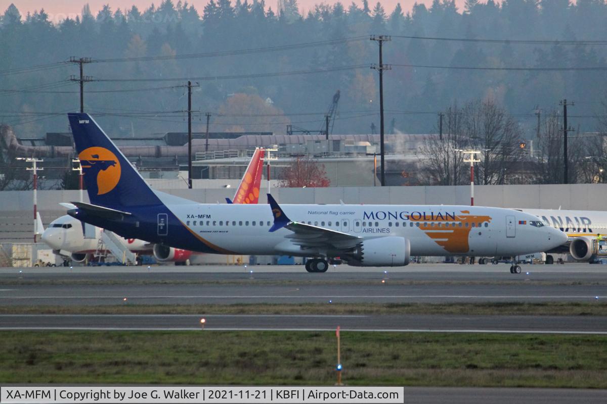 XA-MFM, 2019 Boeing 737-8 MAX C/N 43310, Mongolian Airlines NTU airframe. Seen at BFI shortly after sunset.