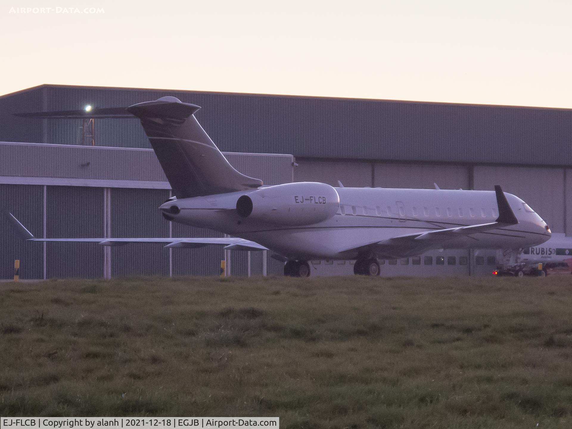 EJ-FLCB, 2001 Bombardier BD-700-1A10 Global Express C/N 9083, Parked late evening outside the Aigle hangar at Guernsey, after a registration change