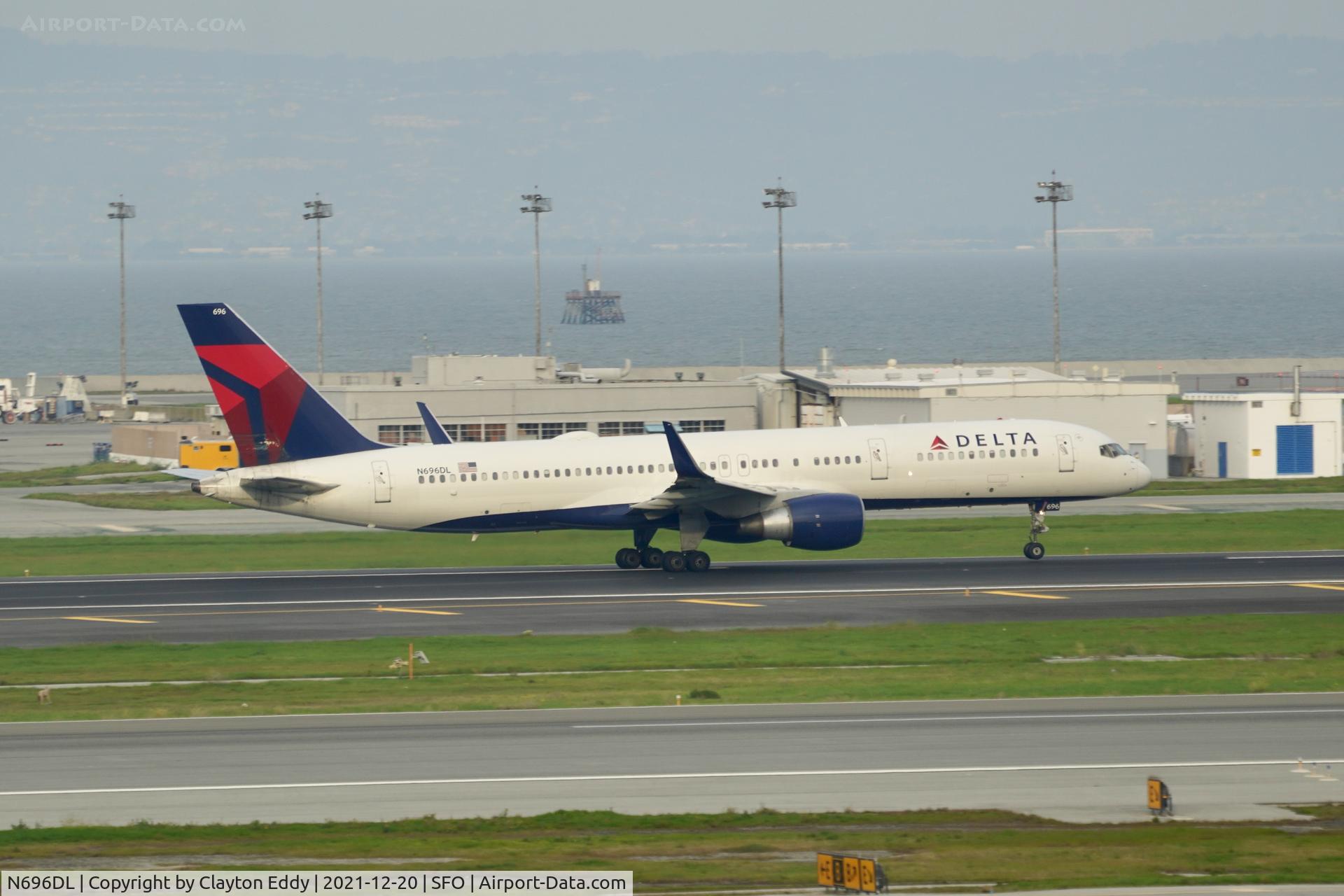 N696DL, 1999 Boeing 757-232 C/N 29728, Pic taken from SkyTerrace. Departing runway 10 SFO 2021.