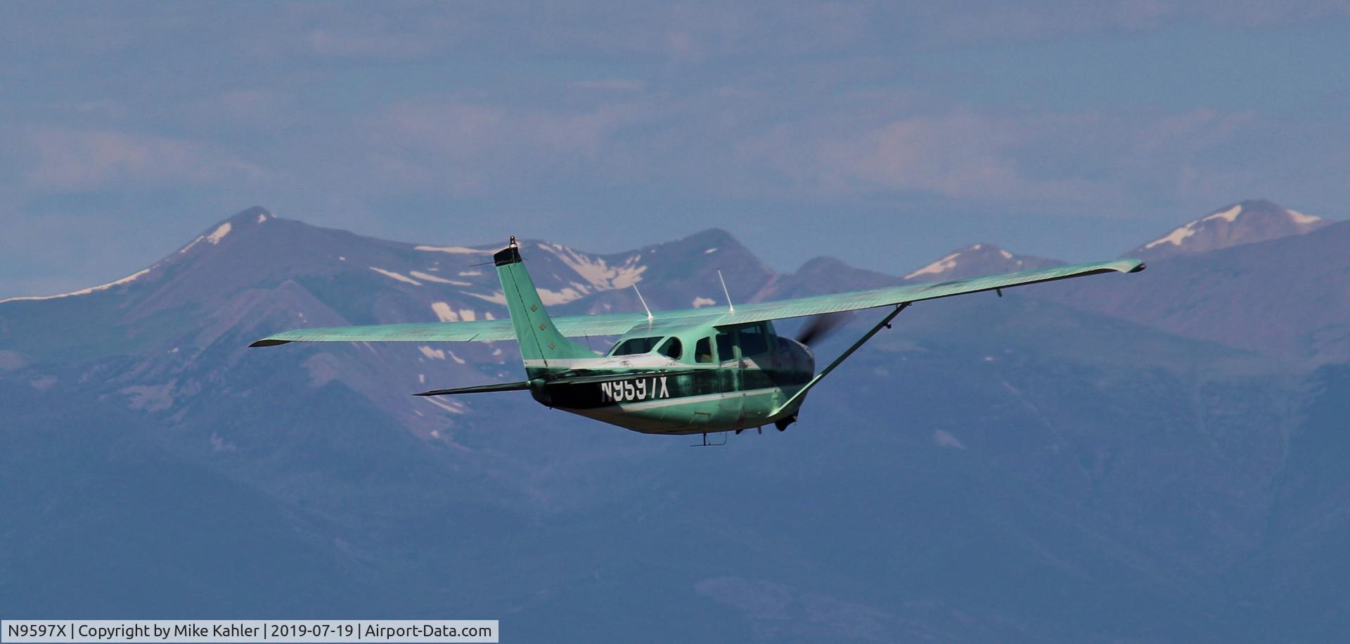 N9597X, 1962 Cessna 210B C/N 21057897, In the mountains.