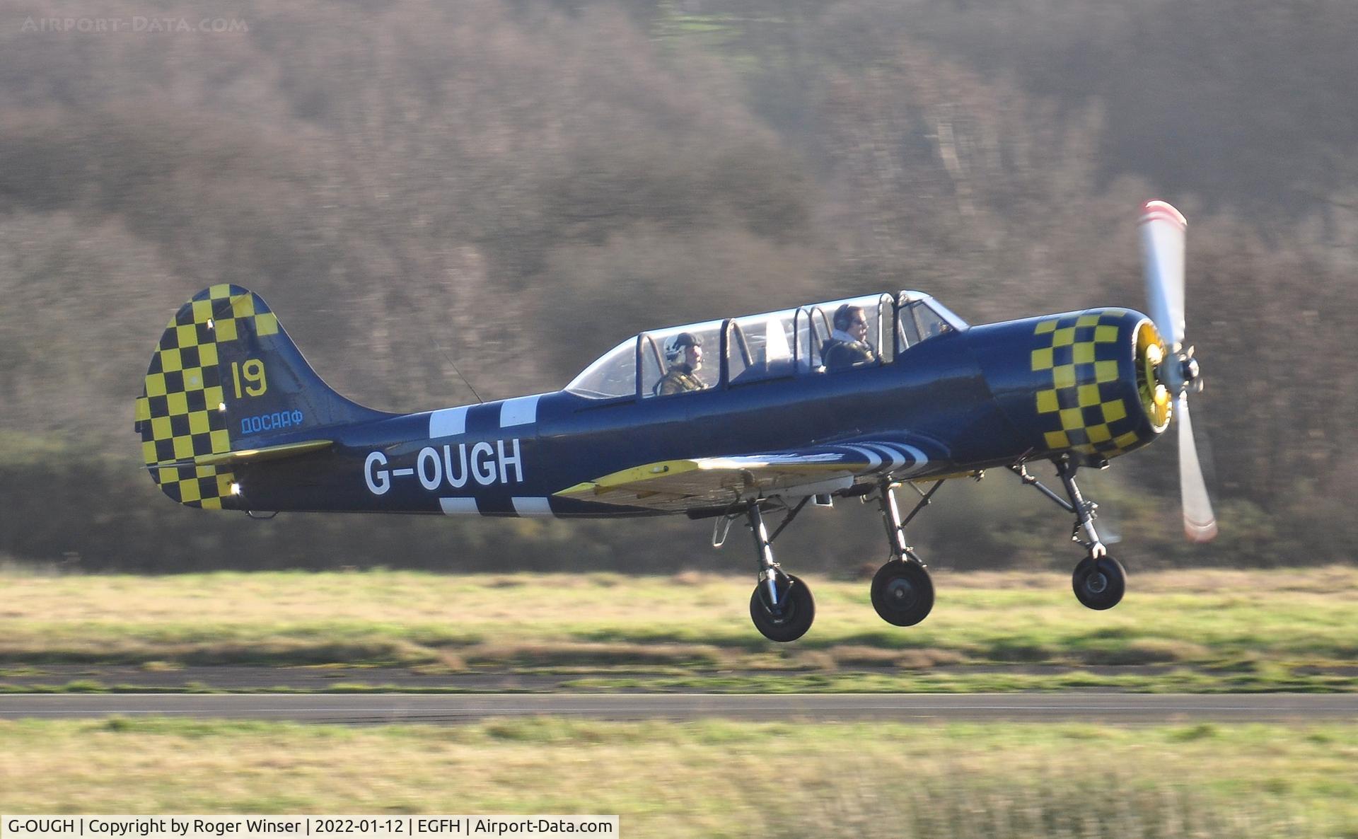 G-OUGH, 1987 Bacau Yak-52 C/N 877404, Resident aircraft departing Runway 28.