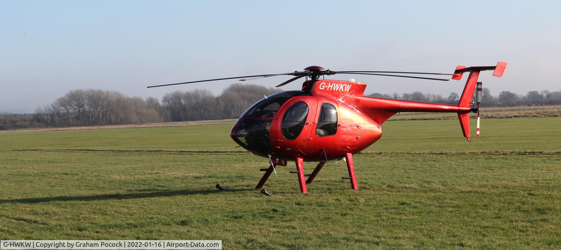 G-HWKW, 1998 Hughes 369E C/N 0537E, Great way to arrive at a car show! Beautiful!