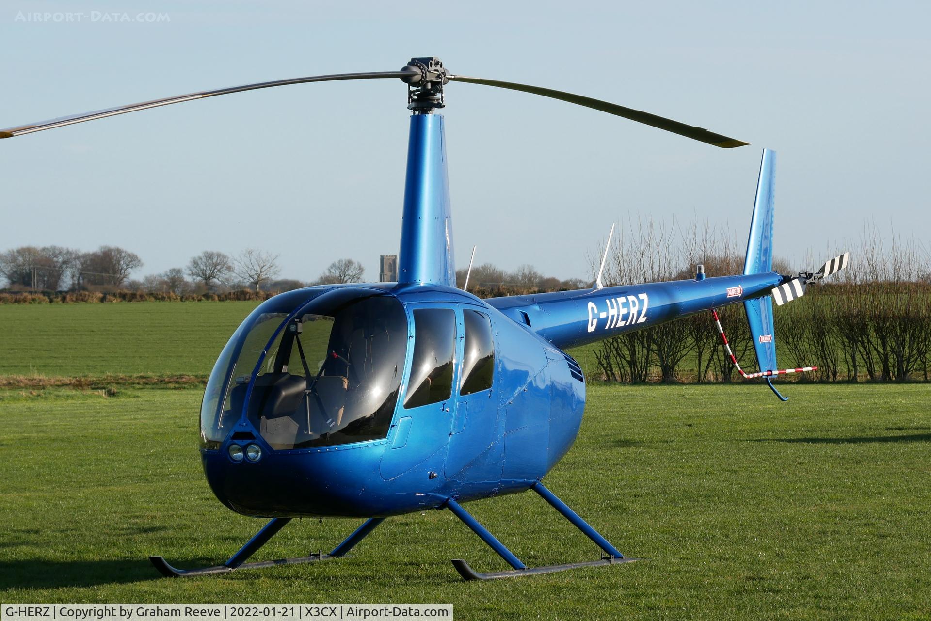 G-HERZ, 1997 Robinson R44 Astro C/N 0381, Parked at Northrepps.