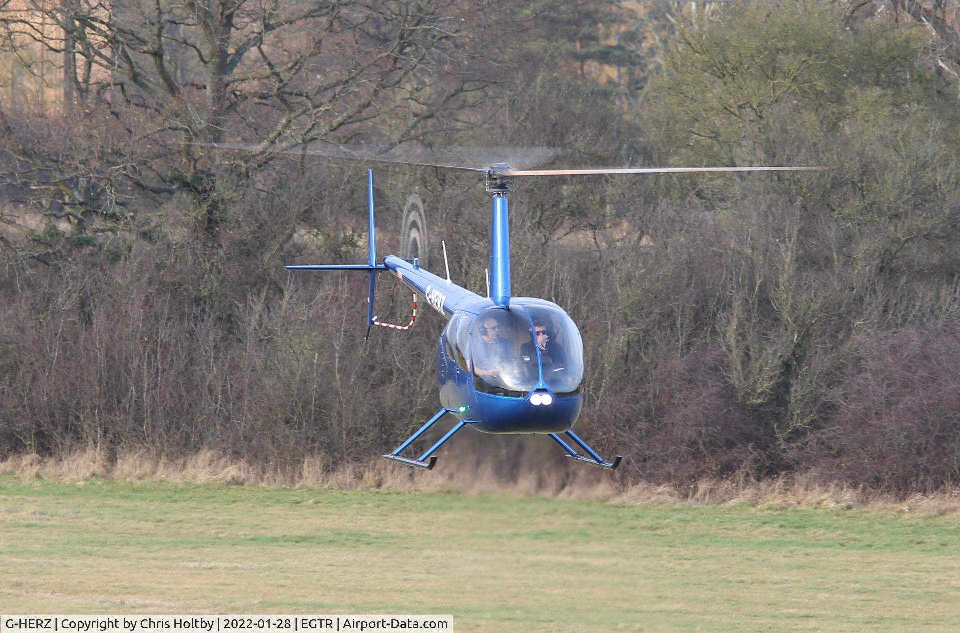 G-HERZ, 1997 Robinson R44 Astro C/N 0381, Lifting off at its Elstree base