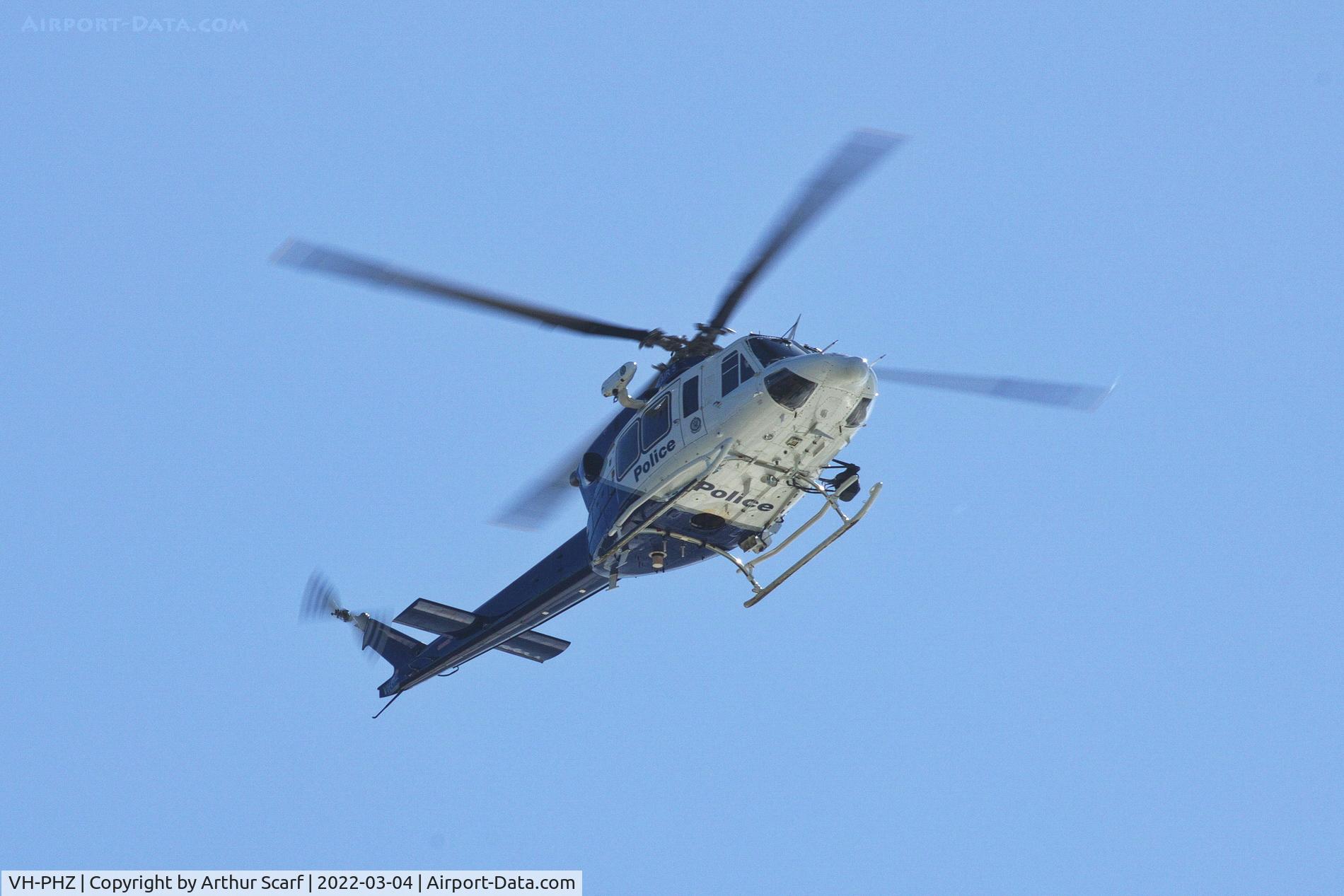 VH-PHZ, 2012 Bell 412EP C/N 36614, Overhead Bonville headland near Coffs Harbour airport March 2022