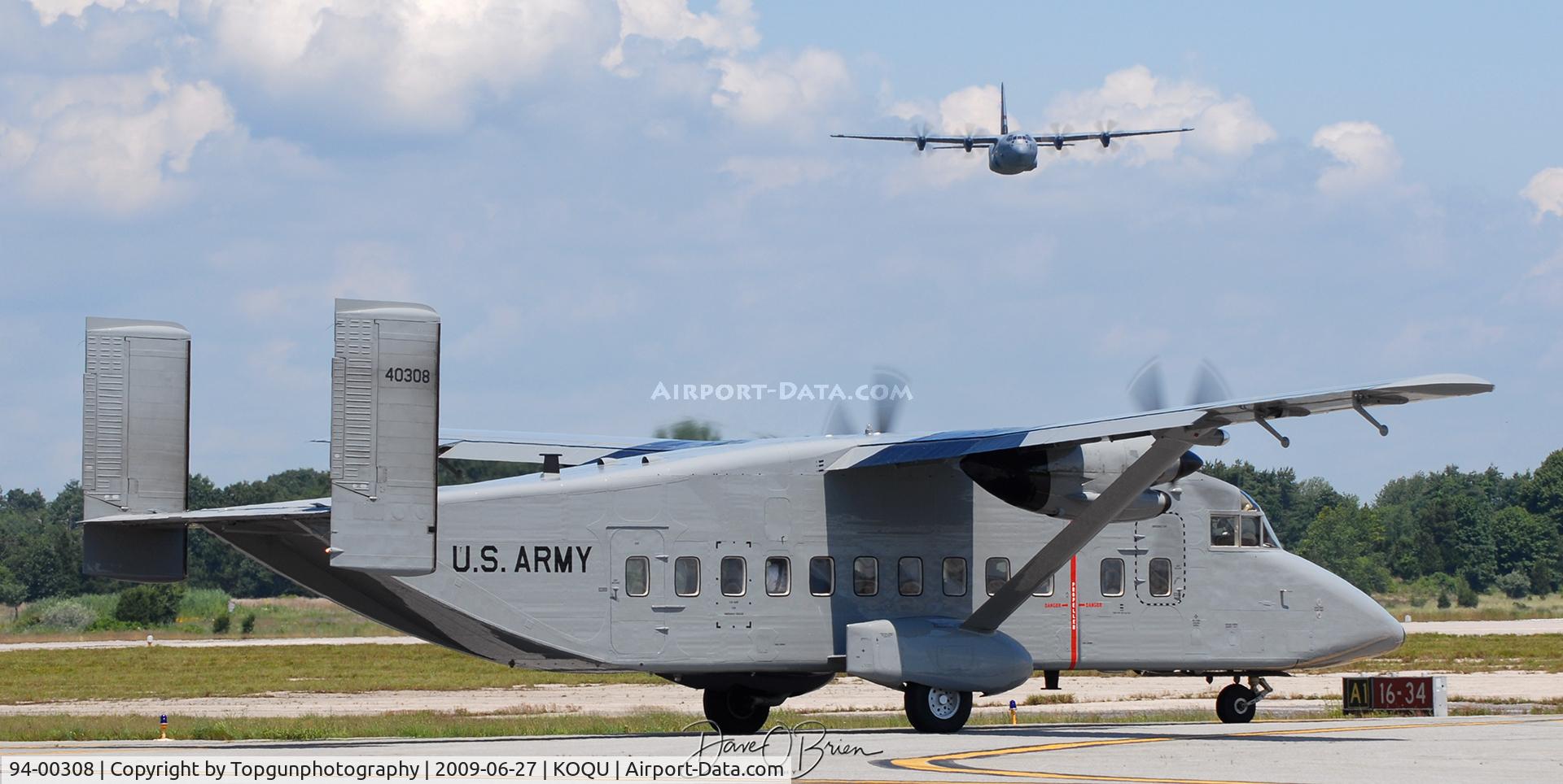 94-00308, 1995 Short C-23C Sherpa C/N SH3422/AK-022, Sherpa holding short of taxiway Alpha while Herc Demo is inbound