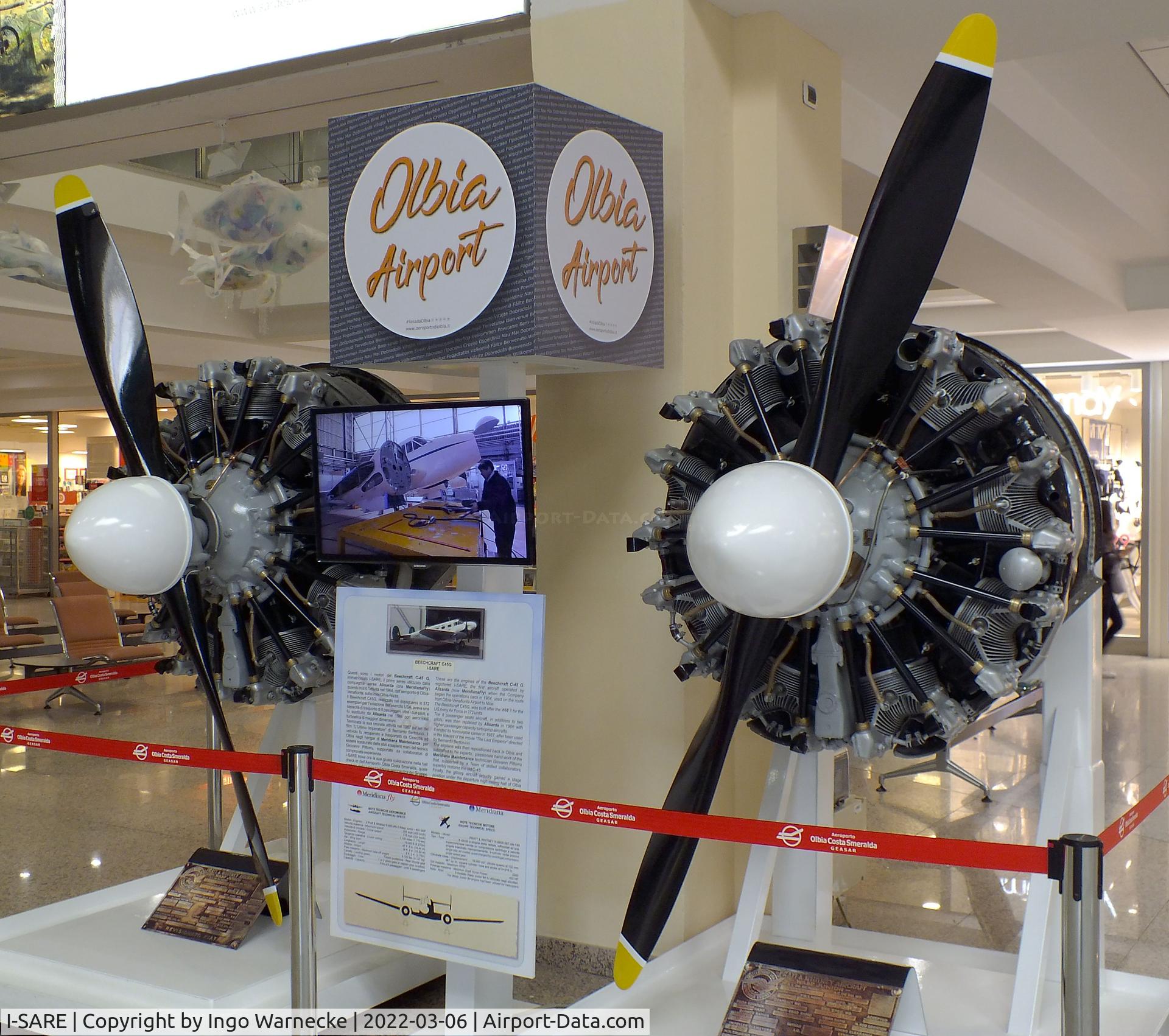 I-SARE, Beech C-45F Expeditor C/N 6668, Beechcraft C-45F Expeditor, original engines exhibited separately inside the terminal at Olbia Costa Smeralda Airport, Olbia