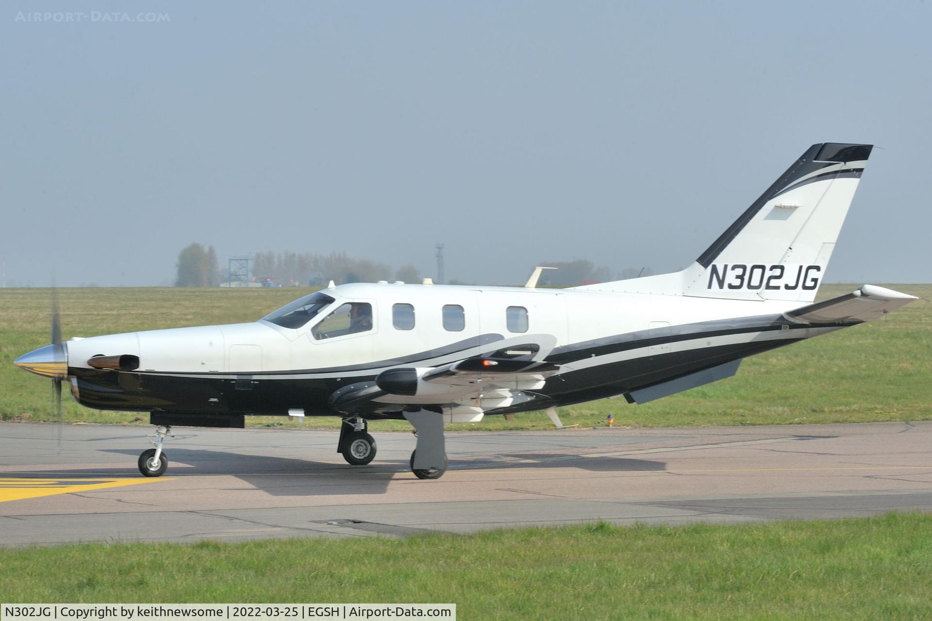 N302JG, 2004 Socata TBM-700 C/N 302, Arriving at Norwich from Guernsey.