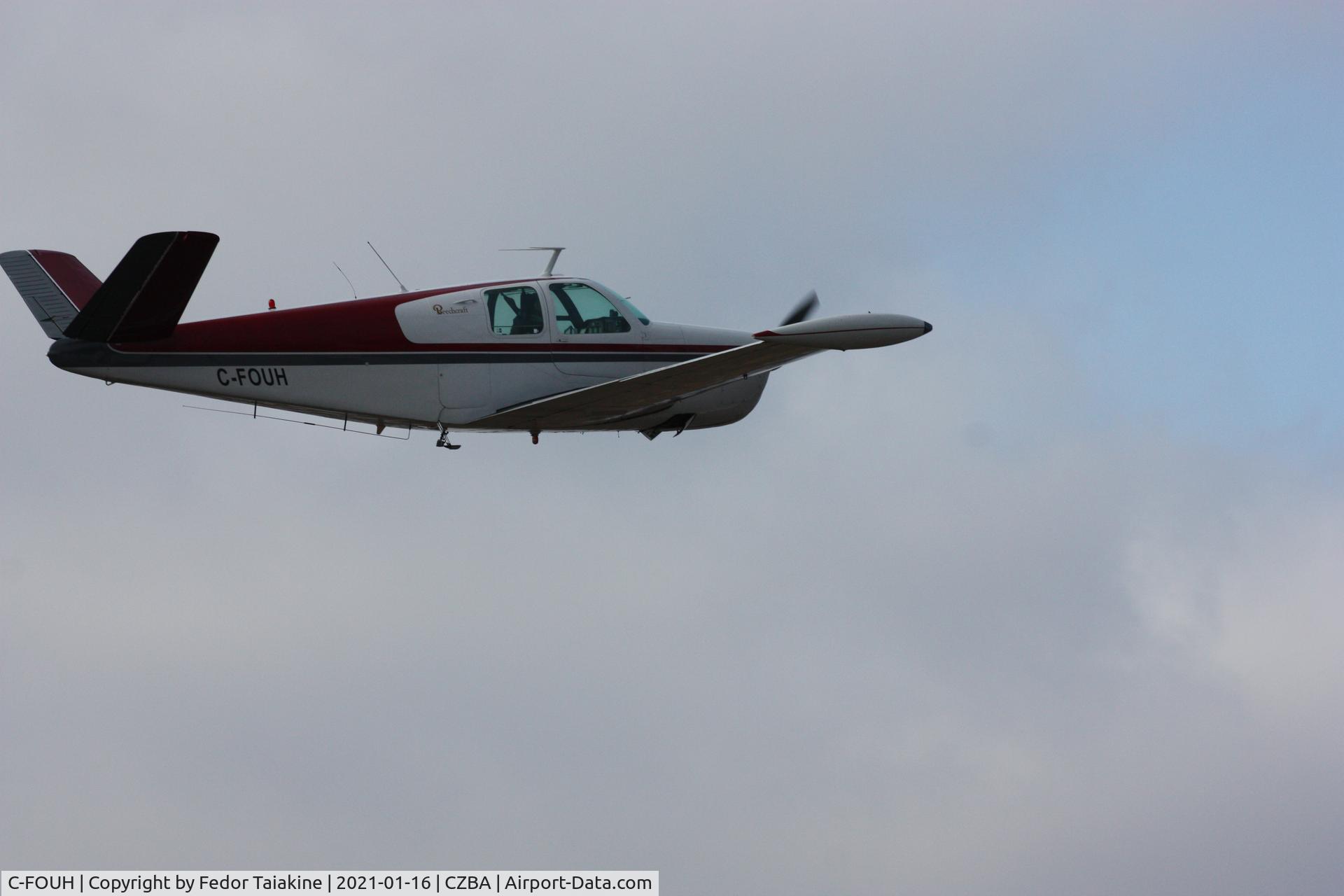 C-FOUH, 1950 Beech B35 C/N D-2649, Low over CZBA