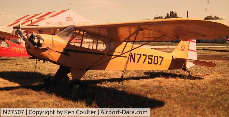 N77507, 1946 Piper J3C-65 Cub C/N 21998, I did my solo in this aircraft in 1972.  Harry McCandless was the FBO and you can see the picture of his operation in the background.  Harry died in the mid 80's and his South Omaha airfield closed in 1986.  Off the Jeppesen charts in 1999.