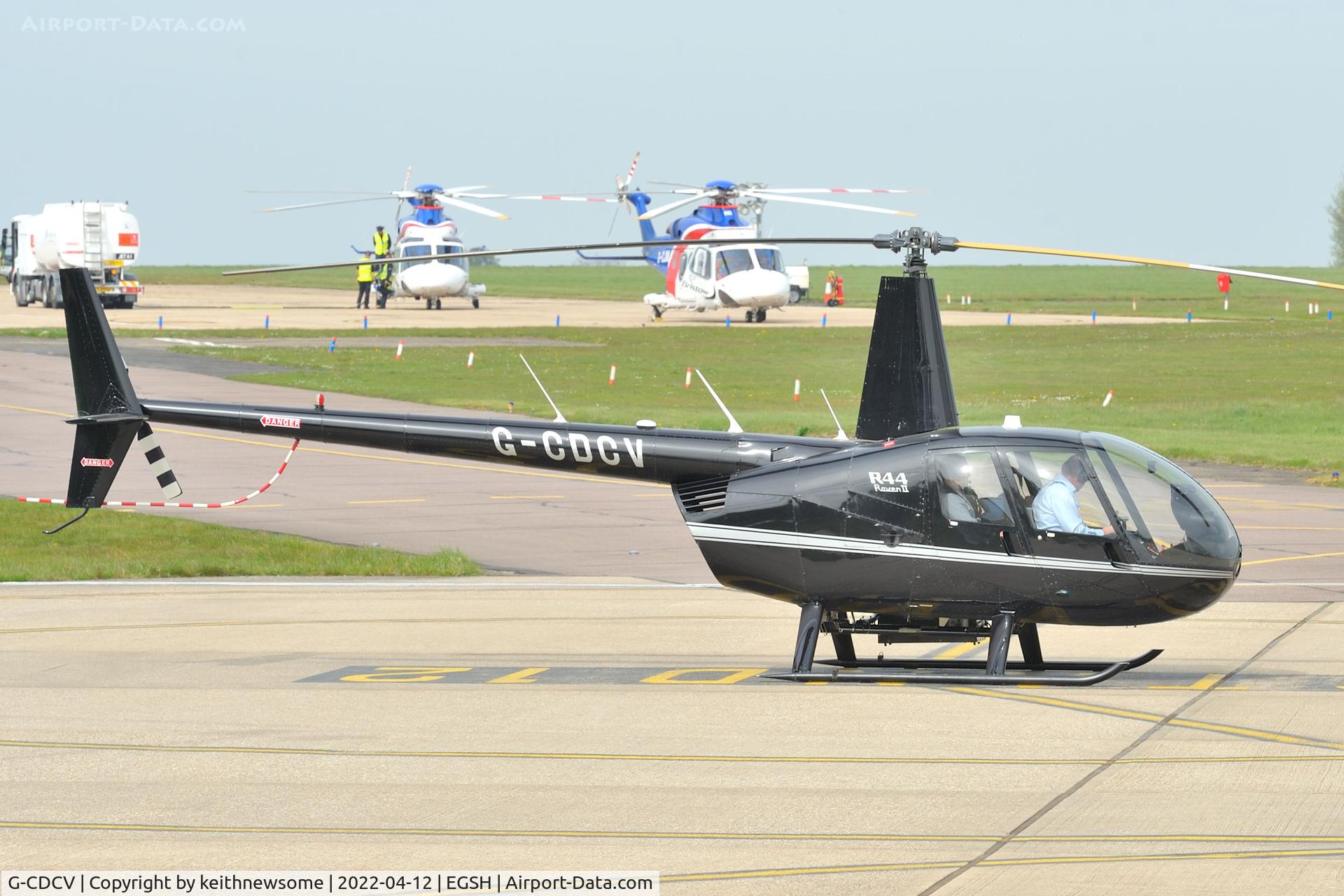 G-CDCV, 2004 Robinson R44 Raven II C/N 10536, Parked at Norwich.