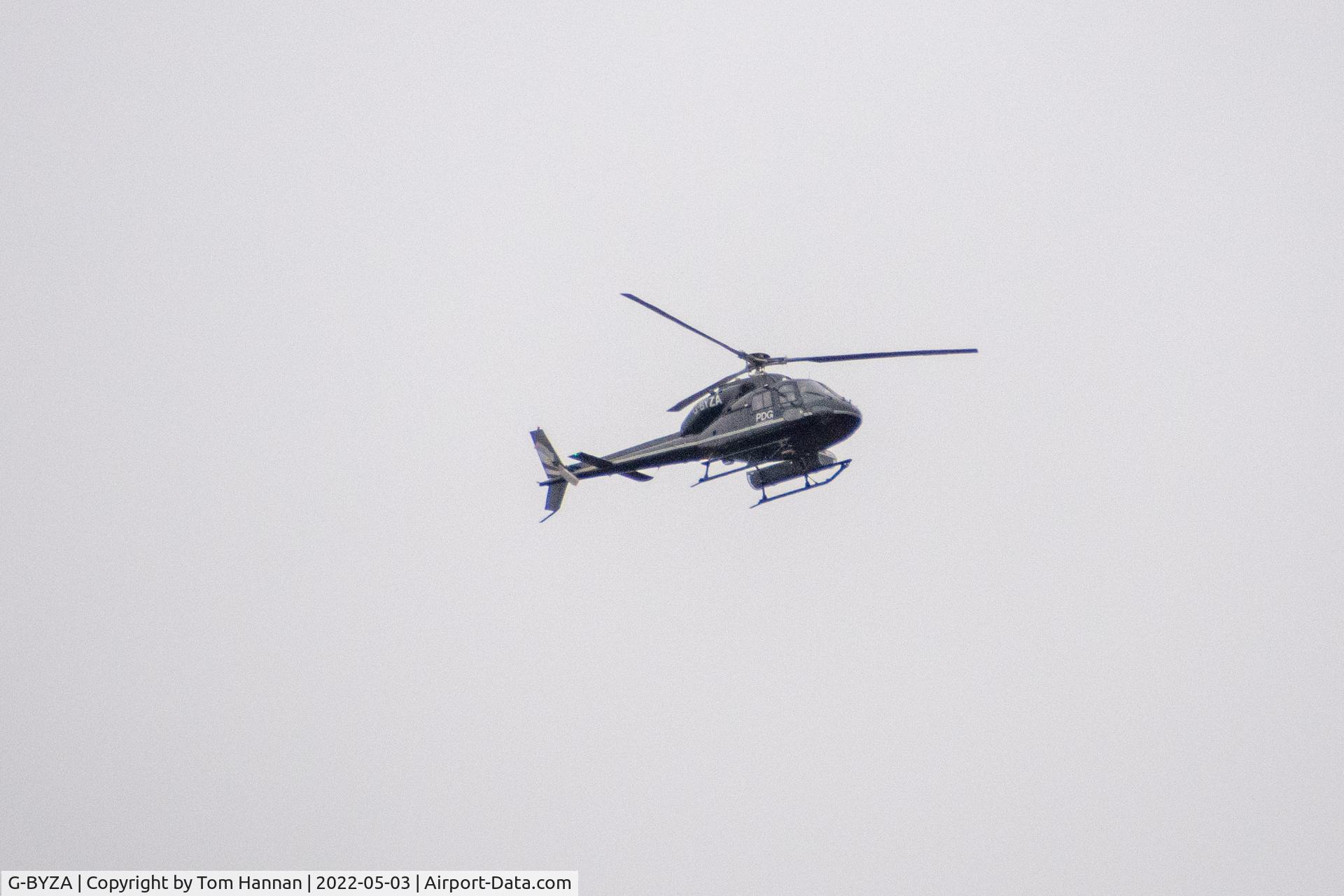 G-BYZA, 1992 Aerospatiale AS-355F-2 Ecureuil 2 C/N 5518, Flying over Stonehaven, Scotland, 3 May 2022 with 2 other PDFG Group aircraft