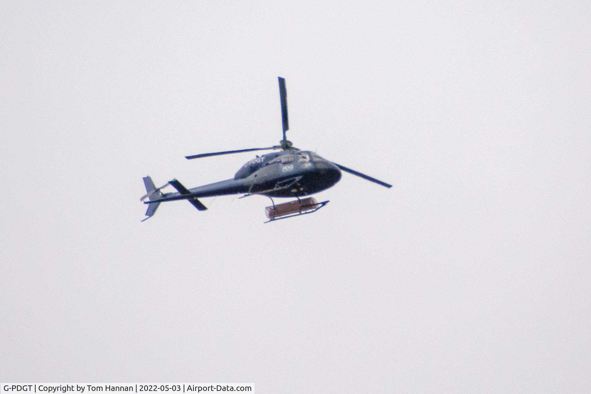 G-PDGT, 1988 Aerospatiale AS-355F-2 Ecureuil 2 C/N 5374, Flying over Stonehaven, Scotland with two other PDG aircraft