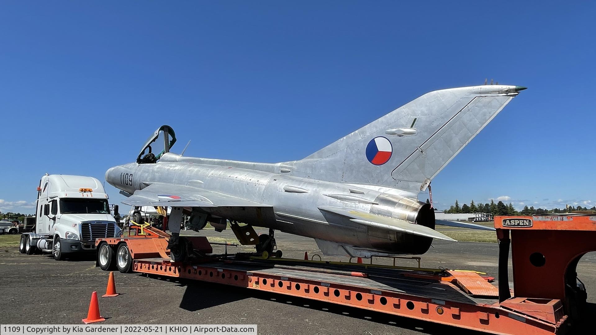 1109, 1990 Dornier 228-212 C/N 8188, Mig-21F-13 on a trailer at KHIO.