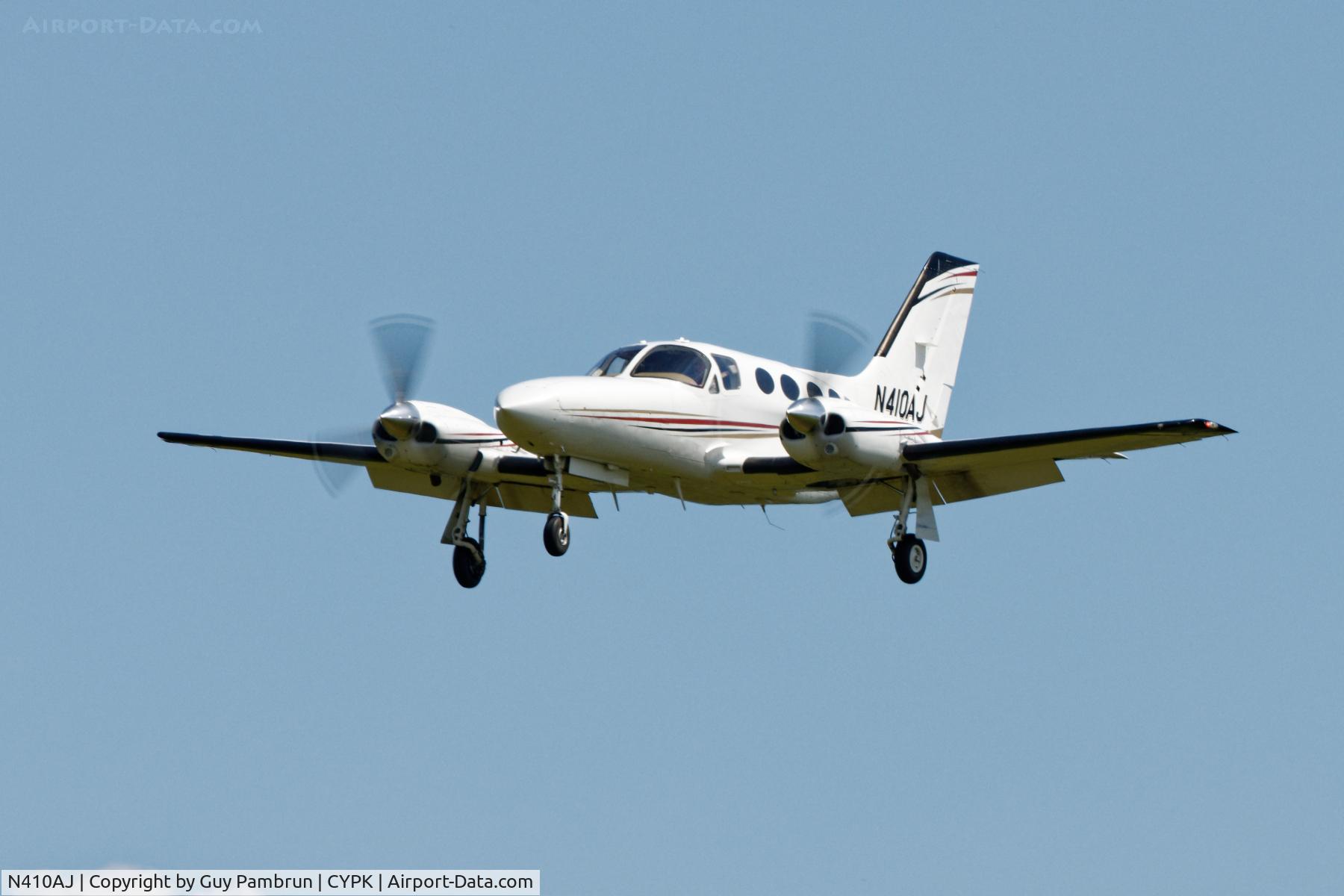 N410AJ, Cessna 421C Golden Eagle C/N 421C1093, Landing on 26L