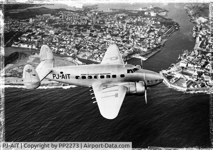 PJ-AIT, 1938 Lockheed 14-WF62 Super Electra C/N 1412, PJ-AIT flyby over harbour entrance of Willemstad (Curacao)